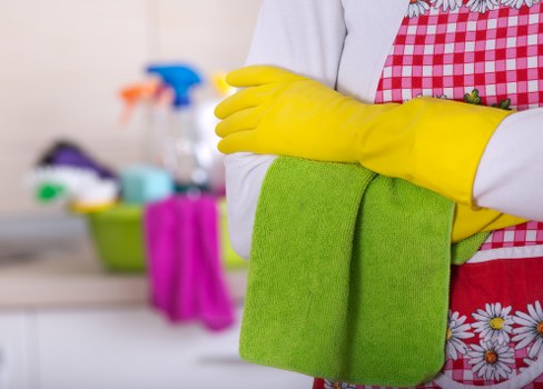 Carpet cleaning operative working carefully in a property